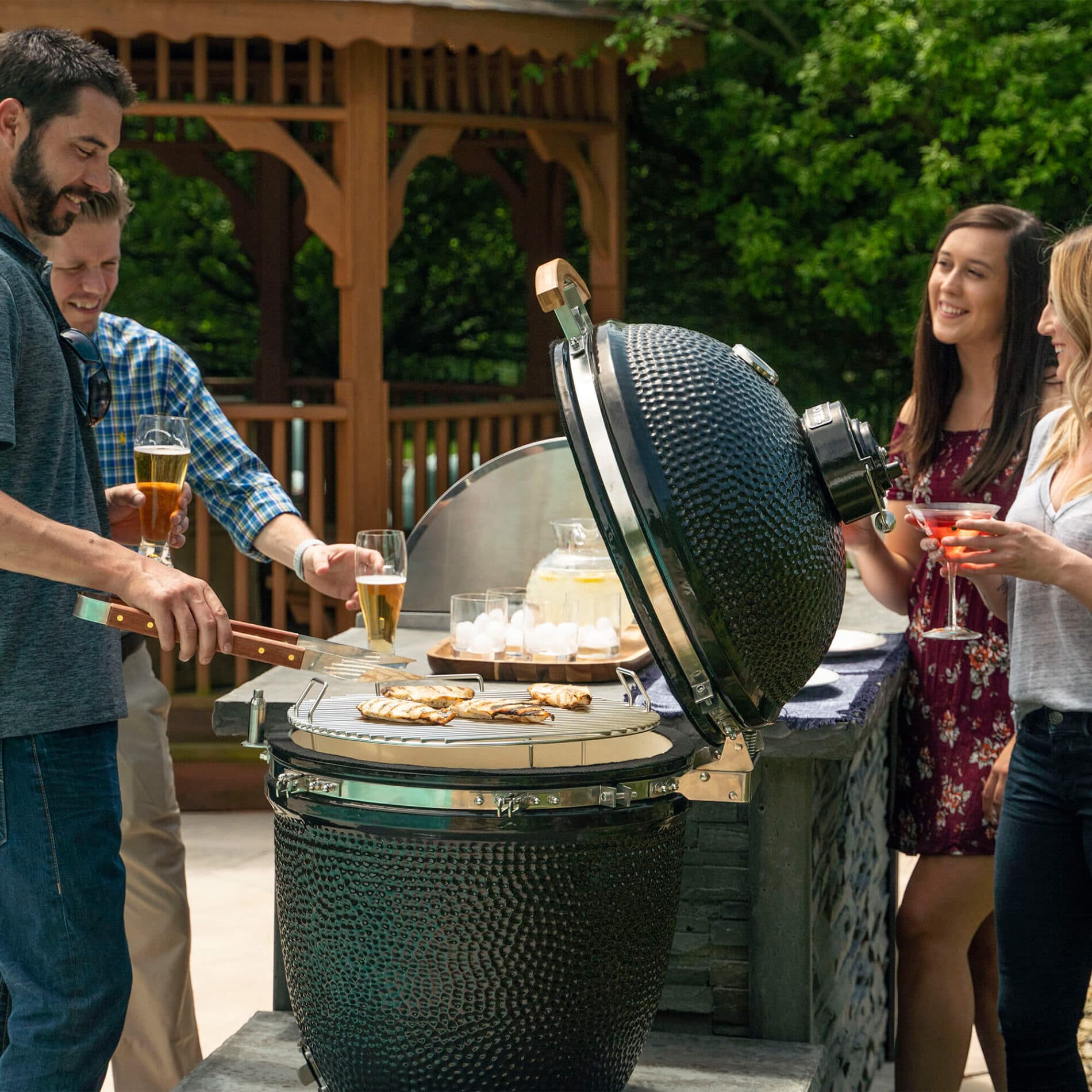 People Talking Around Coyote Asado Smoker