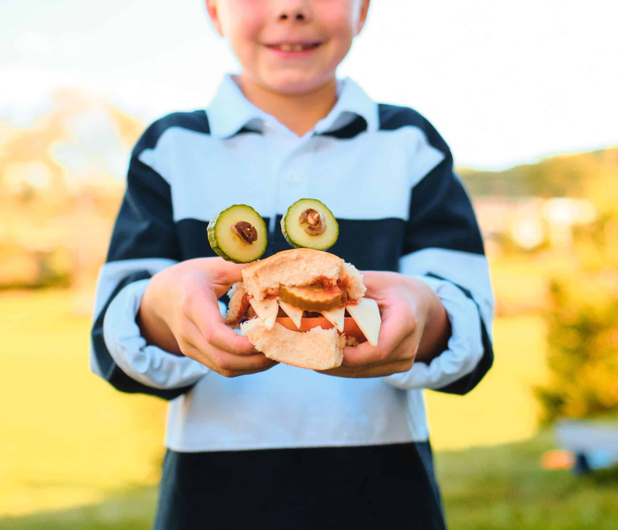 Young Boy Holding Monster Slider
